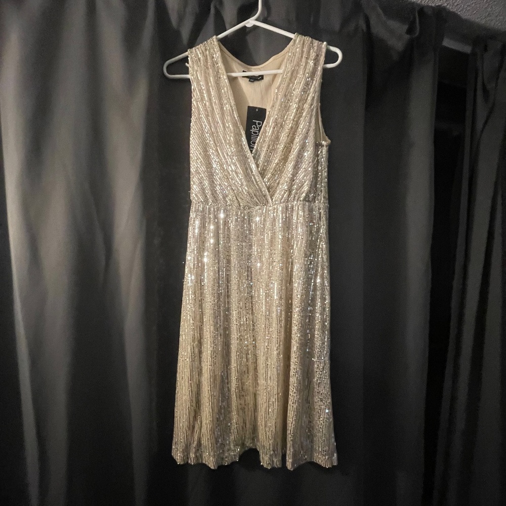 Never worn “papillon” Sequined Surplice (crossover neck line ) cocktail dress